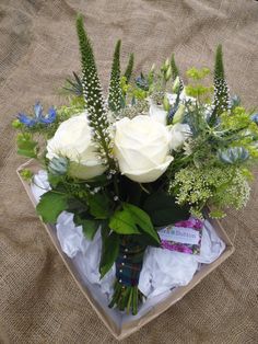 Cream brides bouquet with hints of blue